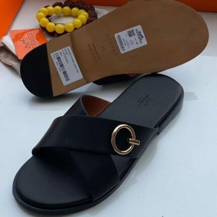 Hermès Cross-Strap Leather Slides – Black with Gold Ring